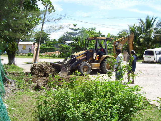Back Hoe and Front end loader at Mi Yard