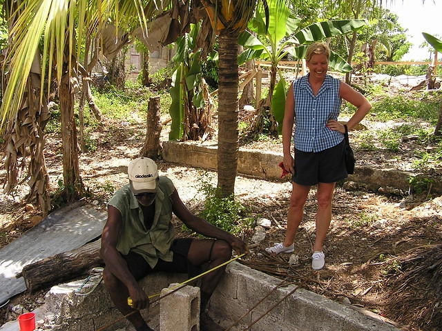 TLC watching the worker measure & cut rebar