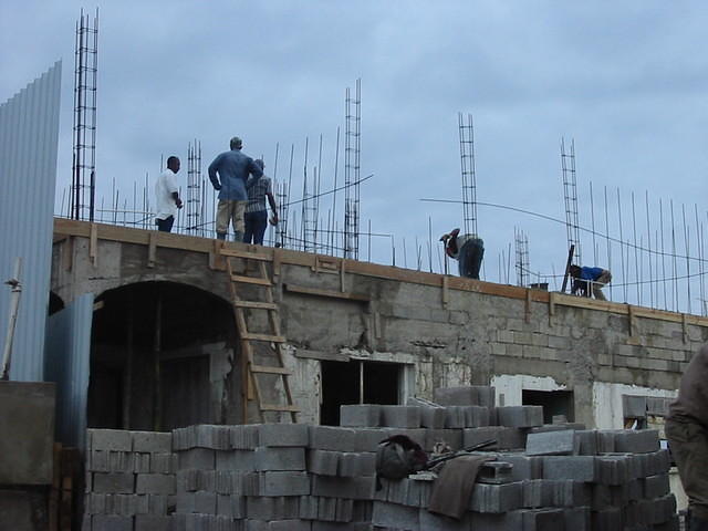 Slab on, top floor construction begins