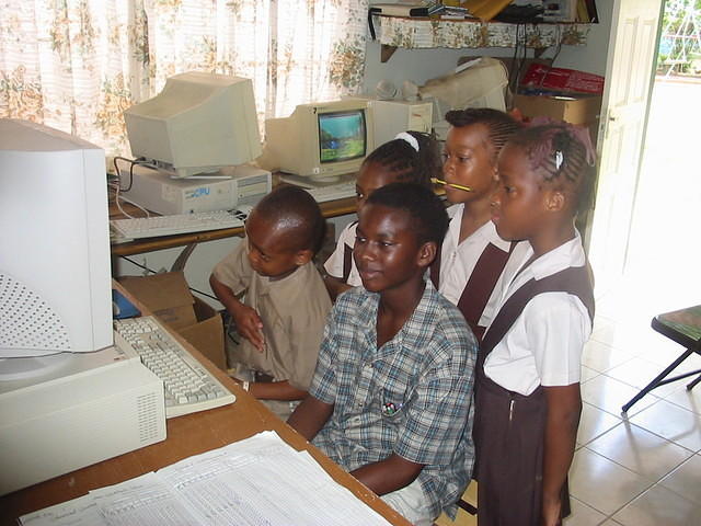 Dimitri (Grade 6) gives Grade One a lesson whilst teacher takes a break