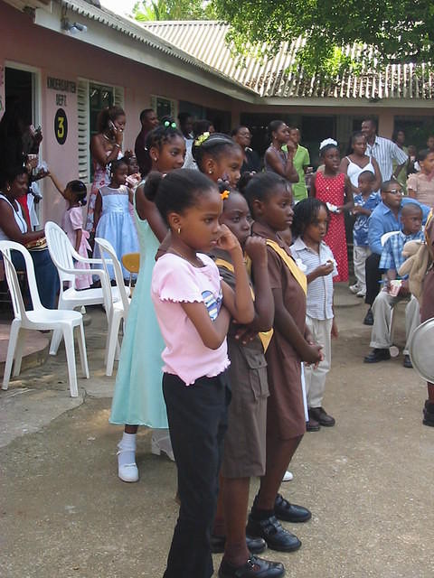 Children wait in anticipation to see who has won?
