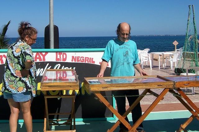 Negril's Famous Coin Man aka Andy displaying his wonderful coin art