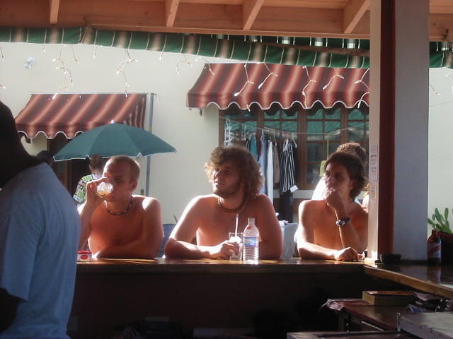 The guys just chill at the bar watching the game