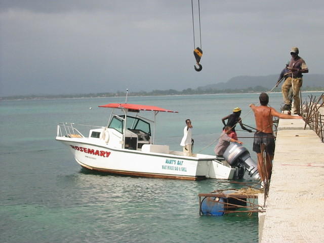 First boat to the dock, Williams's own 'Rosemary'