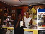 Carmen serving some freshly made popcorn to Caesar our local TV expert