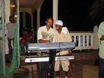 Resident MC 22 Pac entertans the keyboard player